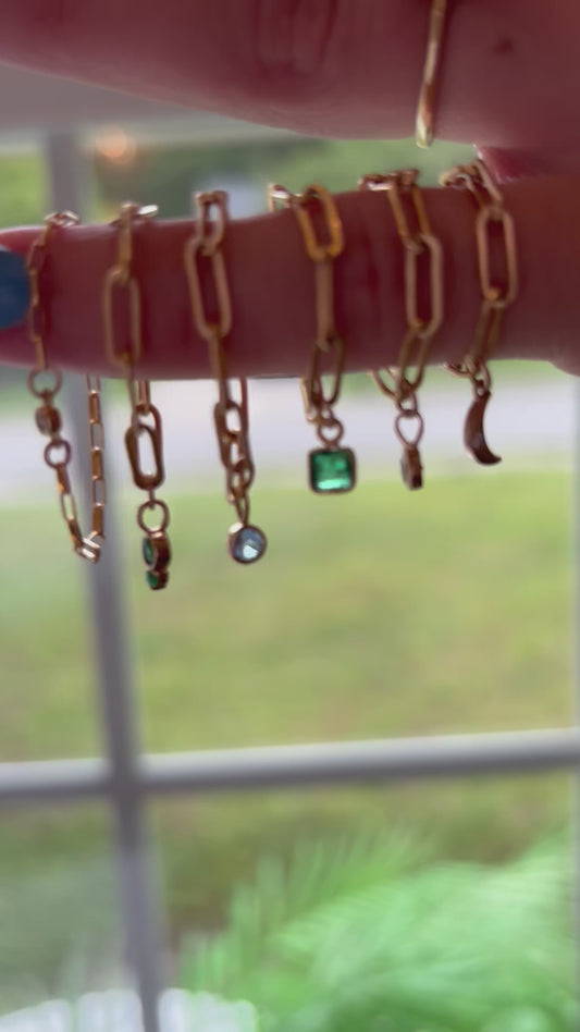 Gold Chain Rings With Vibrant Stones.